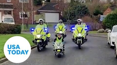 Heartwarming moment police join boy for patrol down UK street | USA TODAY