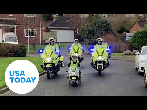 Heartwarming moment police join boy for patrol down UK street | USA TODAY