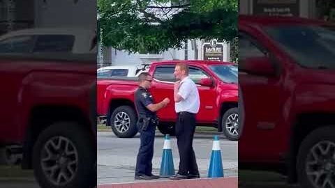 Police officer helps young man while directing traffic | USA TODAY #Shorts
