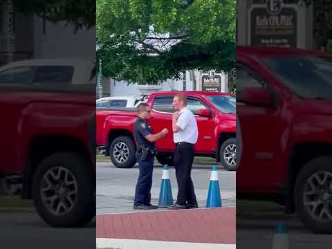 Police officer helps young man while directing traffic | USA TODAY #Shorts