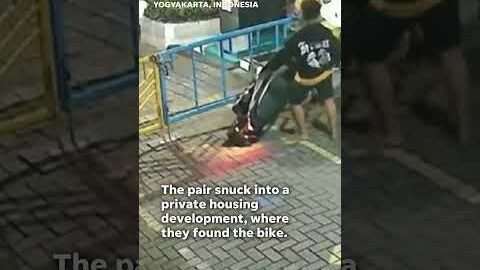 Not so fast! Thieves struggle to get stolen motorbike over locked gate #Shorts