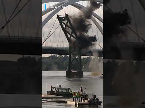 Controlled explosion sends pieces of a bridge tumbling into the water #Shorts