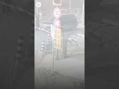 Car has near-miss close encounter with train in China | USA TODAY #Shorts