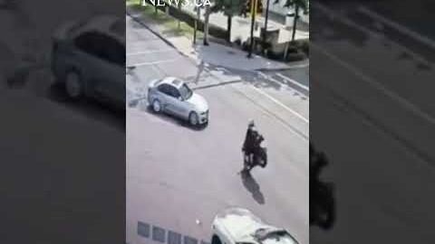 Crash leaves motorcycle dangling from traffic light