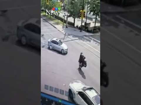 Crash leaves motorcycle dangling from traffic light