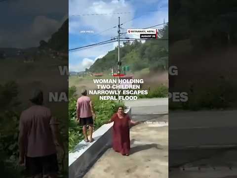 Woman holding two children narrowly escapes Nepal flood